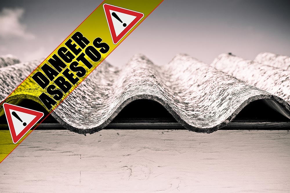 Asbestos lined corrugated iron with a text overlay stating "asbestos" with a warning symbol over it